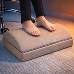 Ergonomic footrest for improved sitting posture